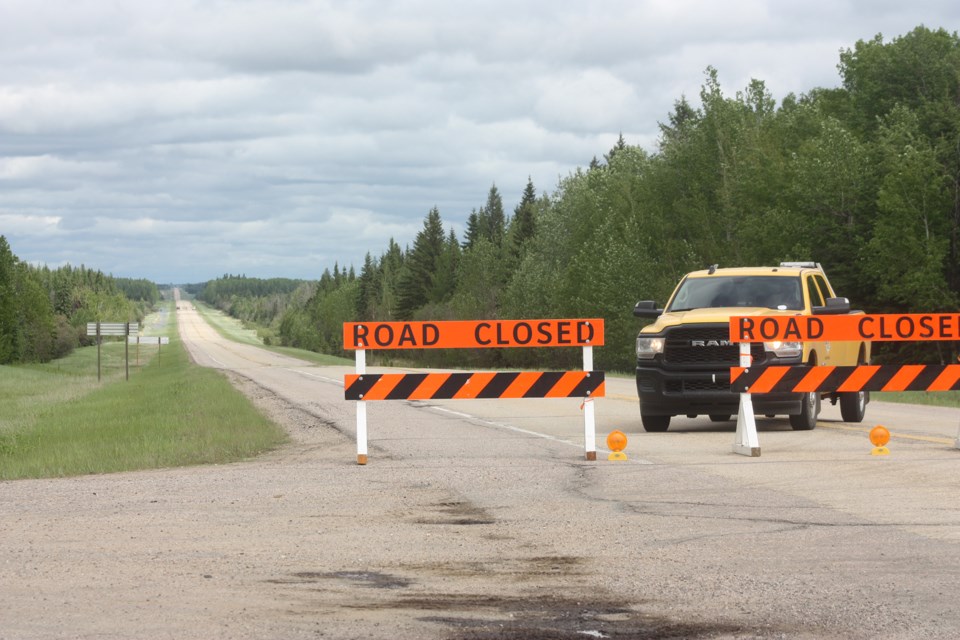 A culvert washout on Highway 55 June 8 resulted in a significant chunk of the road going missing. Travellers heading east of Athabasca were turned around and rerouted as highway contractors EMCON had the highway blockaded east of Amber Valley by mid-afternoon and it currently remains in place. UPDATE: June 10 Noon, an EMCON representative said if all goes according to plan today, Highway 55 will reopen by late afternoon. Signs will be placed to notify the speed limit is now 80m km/h over the repaired section of the highway, as there will likely be a bump. The section will be repaved at a later date.

Chris Zwick/T&C