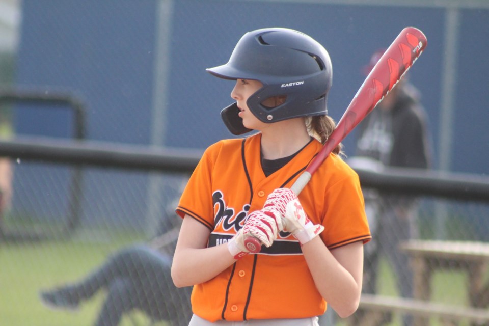 The Barrhead 13 AA Orioles lost in a tightly contested home game 16-13 against the Whitecourt Royals at the end of five innings on May 30. The umpire called the game early as the time limit was exceeded to start a new inning. Barrhead's Mia Schuurman stepping into the batter's box.
