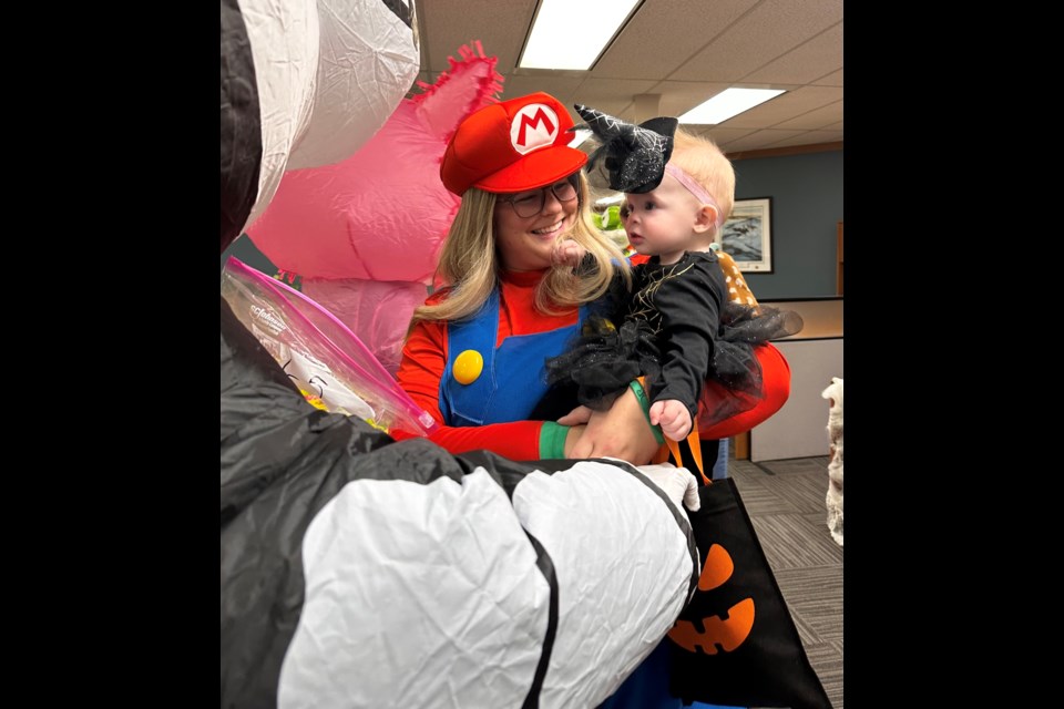 Mario, A.K.A Lauren Jeffries and cute patootie witch Scottie Malone were all smiles for their morning indoor trick or treating. 