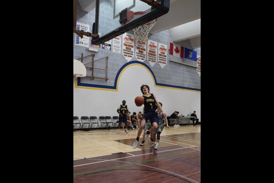 Barrhead Gryphons James McKeever with a jumping layup in the third quarter of a league game against the Athabasca Predators in front of a home crowd on Jan. 24.