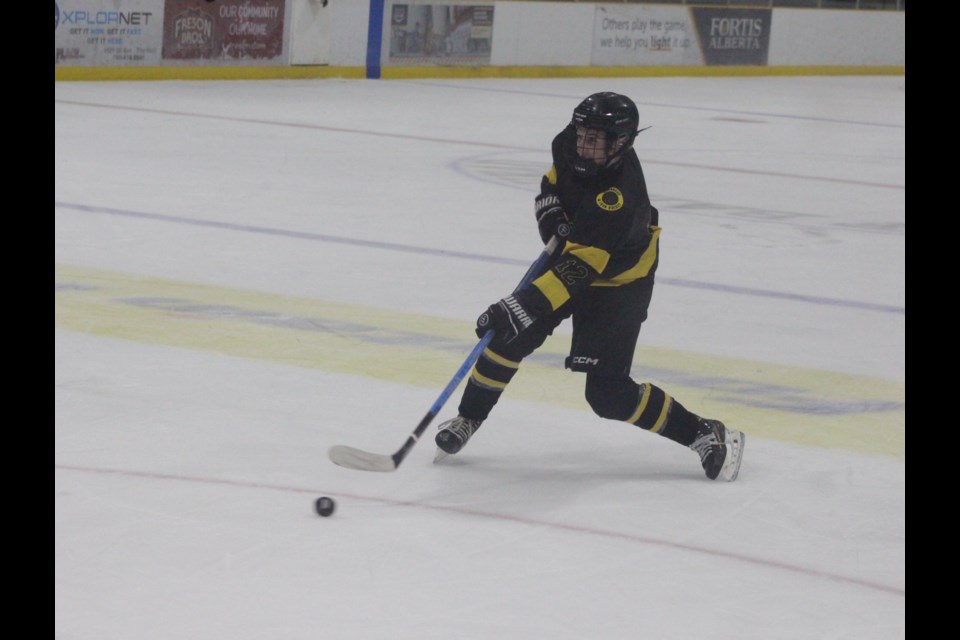 Barrhead's Liam McCauley taking a shot from the point in the period on a power-play.