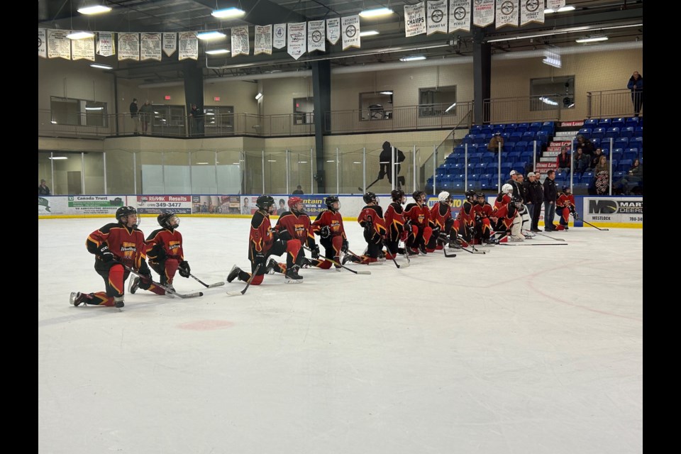 The Westlock Warriors gather on the ice at the conclusion of the Gord Smith Memorial Tournament on Dec. 3. The three-day tournament ended with a championship finale between the Warriors and the Camrose Vikings, with the latter emerging as the winners after a 5-4 victory in overtime.