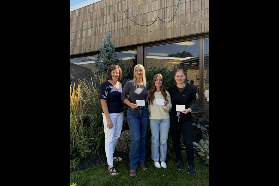 From left: Barrhead Healthcare Centre Auxillary secretary Linda Wolfram presents former BCHS students Reece Gravel, Ella Homeak and Zoe Kaplan with the Dr. B. Bose Nursing Scholarship. Missing is Amy Donkers