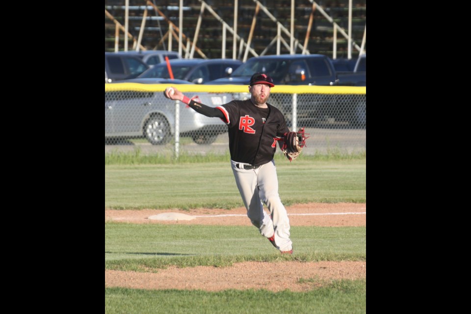 Jordan Brand throws to first base during the Westlock Red Lions' home game on June 6 against the Barrhead Orioles. The Red Lions emerged victorious with a score of 11-7.