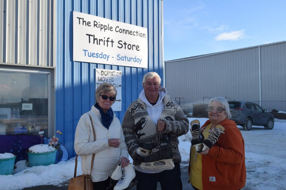 Skate North representatives Bonnie Jevne and Bob Walker with Ripple Connection Support Centre executive director Vernice Aitken with skates that will be donated to youth in Canada’s high north.