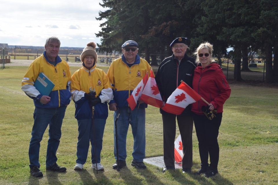 A small band of Royal Canadian Legion volunteers placed more than 200 flags at the gravesites of area veterans at Barrhead's Field of Honour on Oct. 17. From left: Ed Mortimer, Inga Barkemeyer, Chuck Mortimer and Shelley Oswald.