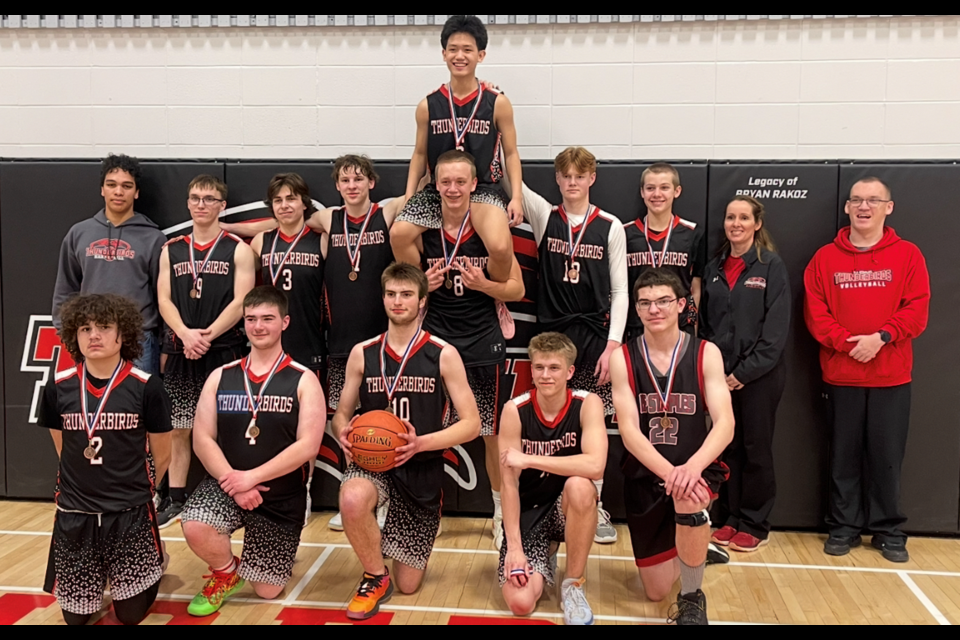 Front, left to right, Logan Mcdonald, Logan Tiffin, Dyllan Marko, and Dyllan Chiswell. Back row, left to right, Coach Josh Booth, Alex McCormick, Bohe Nyal, Mark Oloske, Kris Delos  Reyes on shoulders of Connor Methot, Nate Rigney, Carter Stevens, Coach Jessica Stevens and Coach Cody. 