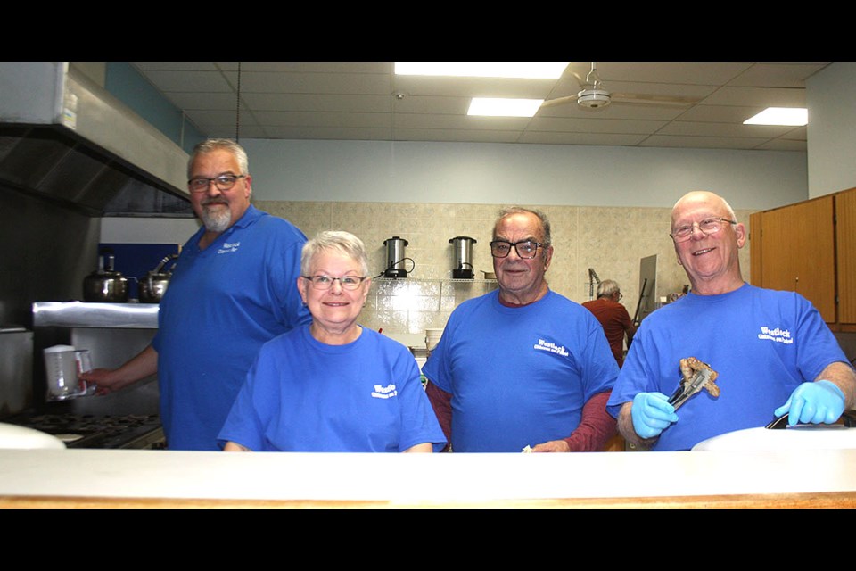 Westlock Citizens on Patrol held a pancake breakfast on Nov. 16 at the Westlock Legion. Busy flipping pancakes and frying sausages and eggs were Ian Shank, Lois Shank, Keith Kohlsmith and Rolly Fagnan.