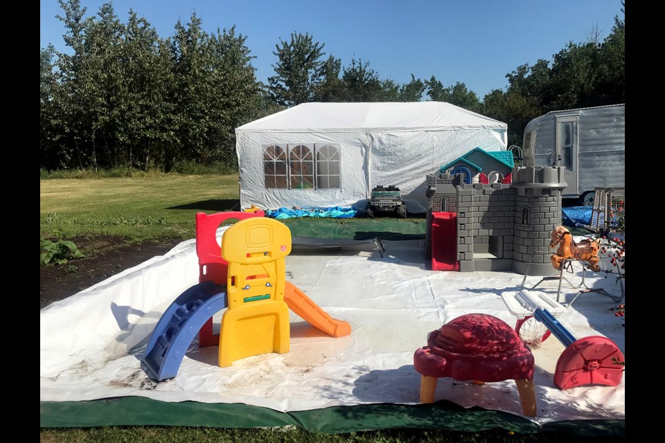 Five-year-old Cohen’s “splash park” in Tiny Town has a water fountain that sprays water. This is where they also hold boat races.