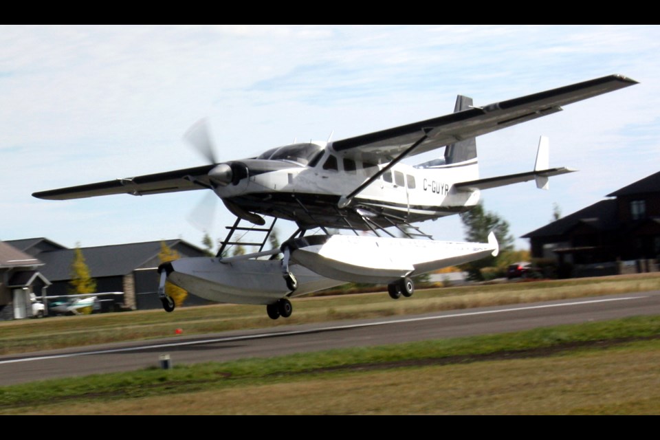 Pilot Alex Dempsy from Victoria, B.C., gives tours of the surrounding area in this Cessna Caravan. The amphibious plane is from Hay River and owned by Landa Aviation that has a hangar at the Westlock Airport. 