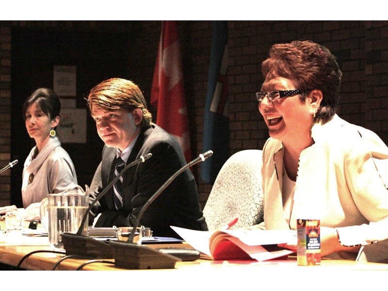 (l-r) Green Party candidate Jule Asterisk, Progressive Conservative Brian Jean and Liberal Karen Young loosen up prior to the election forum at Athabasca University last