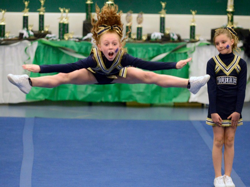 Jayde Semashkewich performs a toe touch while Jassie Joyes looks on during last Saturday&#8217;s annual Cheerfest at the Athabasca Regional Multiplex. The LTIS Grade 4 team,