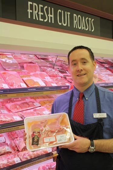 Barrhead Freson Bros. manager Aaron Coutts shows off pork that can be traced back to its farm of origin via DNA records.