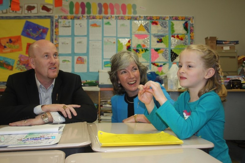 Education Minister Jeff Johnson and Barrhead-Morinville-Westlock MLA Maureen Kubinec chat to students in Lynn Vold &#8216;s Grade 1 class at Neerlandia Public Christian