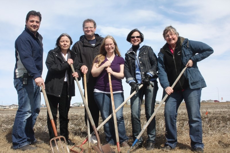 Dig it: Members of the Barrhead Community Garden Association at the 1.4 acre parcel of land, near the proposed site of the new swimming pool. Pictured, from the left, are