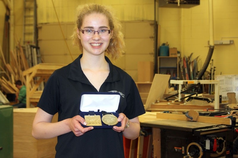 Double gold: Barrhead Composite High School student Rianne Bouma displays the two gold medals she won at the provincial and national skills competitions. Rianne competed in