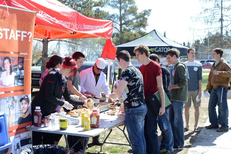 The crowd was continuous at the Tailgate Party &#8216;s beef on a bun Friday afternoon. Students baked the buns and cooked the meat themselves, with the help of Barrhead