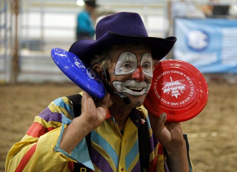 Kids yell yee-ha in hopes of getting a frisbee thrown their way by Ricky Ticky Wanchuck during the Wildrose Rodeo Finals on Sept.19, at the Barrhead Agrena.