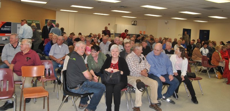 A large crowd attended the forum on April 20. Questions from the audience were submitted to the moderator before the forum began.