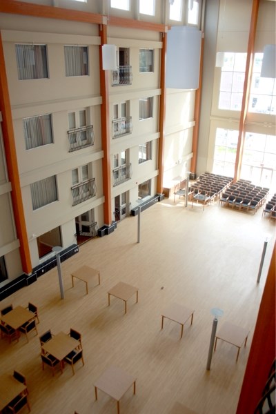 Suites facing the atrium have balconies opening onto the big room of the expansion. Residents will be moving in Aug. 14.