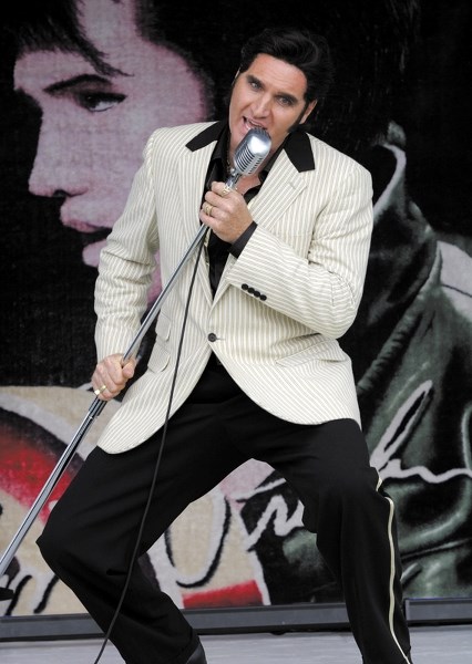 Ronnie Scott gets into the Elvis act Saturday afternoon at the Blue Suede Elvis music festival in Busby.