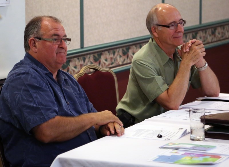 Lac La Biche County mayor Aurel Langevin (left) and Coun. Guy Piquette address the audience at the Westlock amalgamation information meeting July 18 at the Westlock Inn.