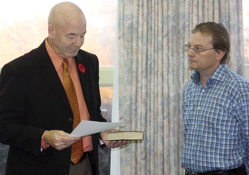 Former Westlock County manager Ed LeBlanc, right, at the swearing in of reeve Bud Massey in October. LeBlanc and the county have mutually agreed to part ways.