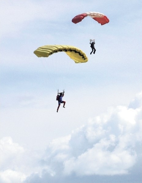 Skydivers sail through the air during the 2015 Canadian National Skydiving Championships on Aug. 1. Officials continue to investigate what led to a 60-year-old skydiver’s