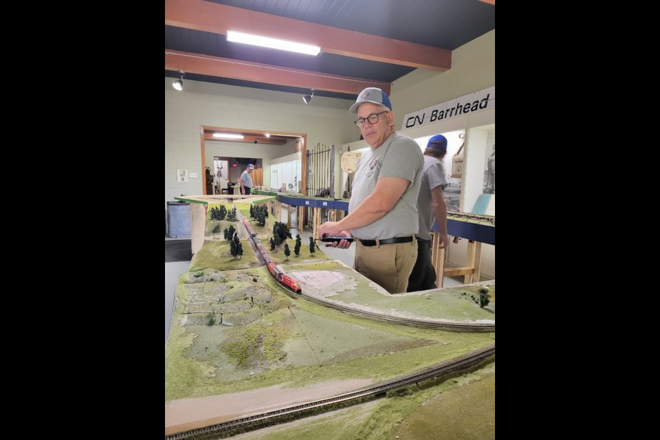 Julian Lengauer operates his train across one of the tracks on the intricate railway system