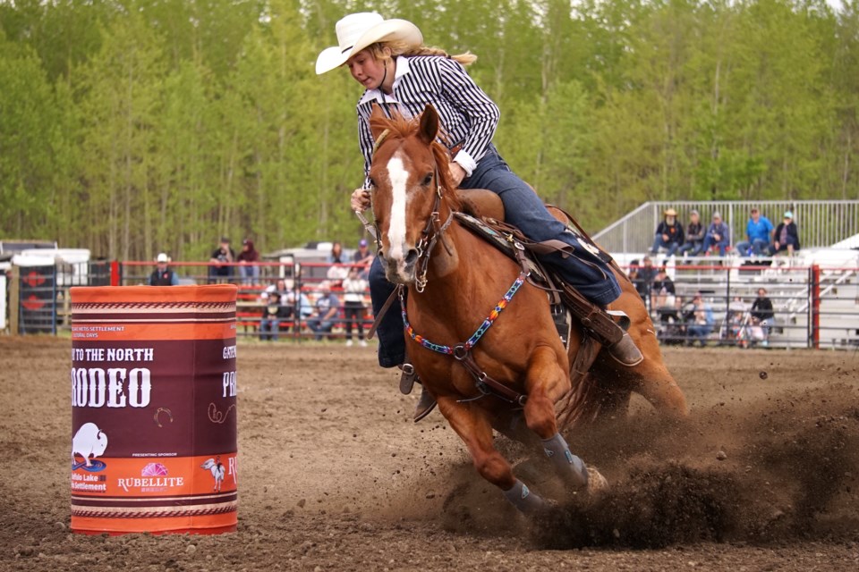 Maple Creek, Sask.’s Kate Beierbach sorrel horse kicks up dirt as the pair round the third and final turn for her run with a time of 17.48.                                