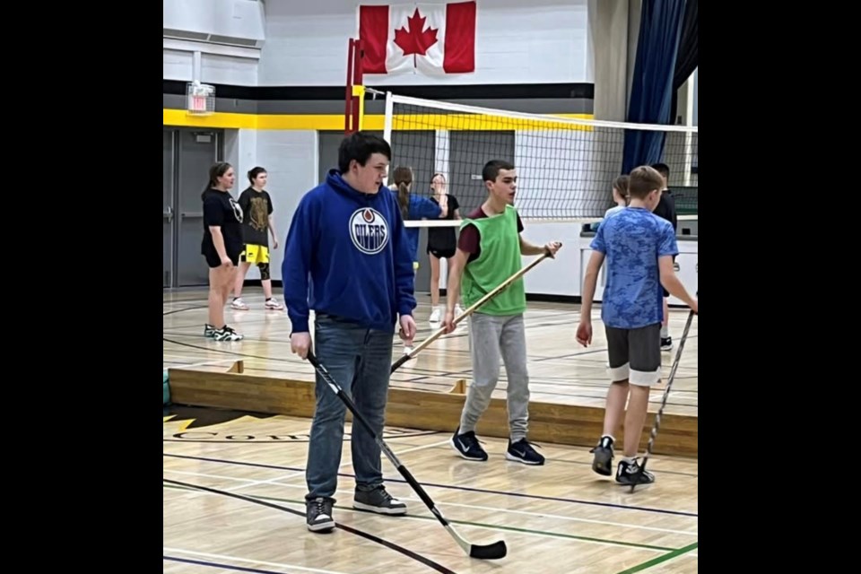 Pembina Hills Community School in Dapp students enjoy Volleyball and Floor Hockey fun: In blue is Dallas Sauter (Gr 8), in green pinnie is Cooper McClanaghan (Gr 9). This is the Grade 8/9 Phys Ed class - teacher Mike Ivey. Photo Supplied.