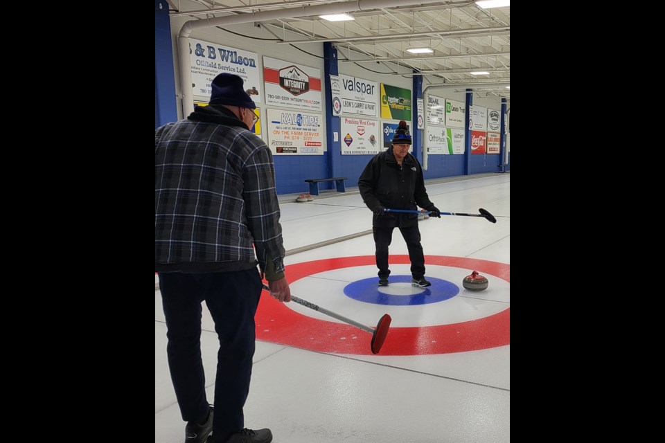 Senior Curling teams Vern Kalmbach (r) and his partner Keith Senneker played Dale Foster (l) and Rod Klumph on Feb. 18 at the Barrhead Curling Rink.