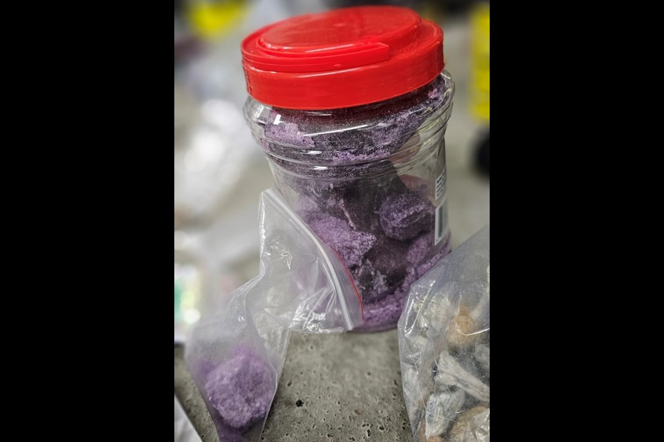 Suspected purple fentanyl in a plastic container.