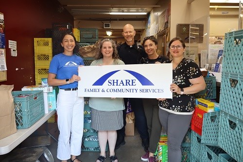 Coquitlam RCMP officers and staff drop off items to SHARE on July 25, 2024, after Cram the Cruiser.