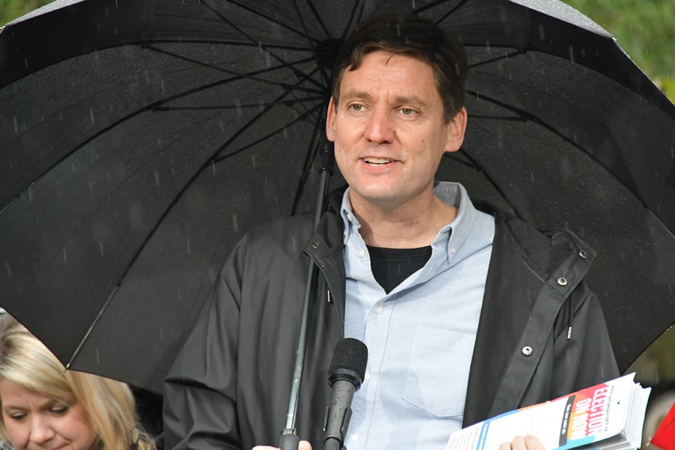 Premier David Eby tells voters to make their mark on Election Day, Oct. 19, during a campaign stop in Coquitlam on Oct. 18, 2024.