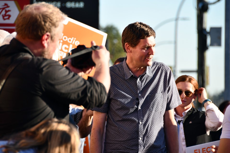 Premier David Eby is greeted by about 100 people outside the new Tri-City BC NDP campaign office on Sept. 4, 2024.