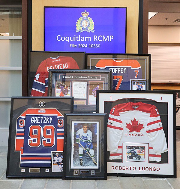 Framed NHL hockey photos and jerseys.