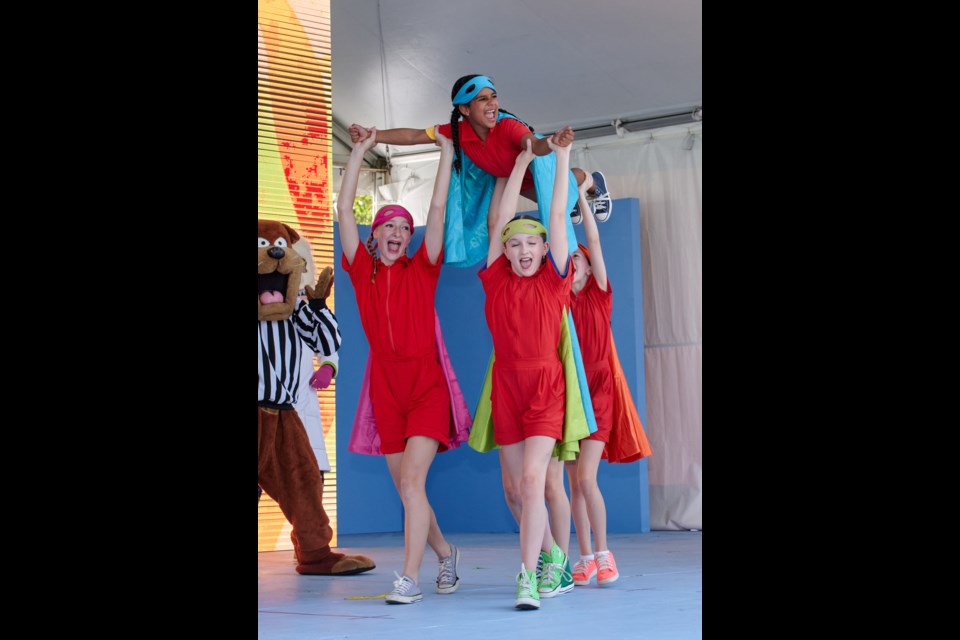 Georgia Kenner, Kenzi Knutsen, and Milani Hussien (all lifting up) of Port Coquitlam perform during the KC Summer Jam at the 2024 PNE Fair. 