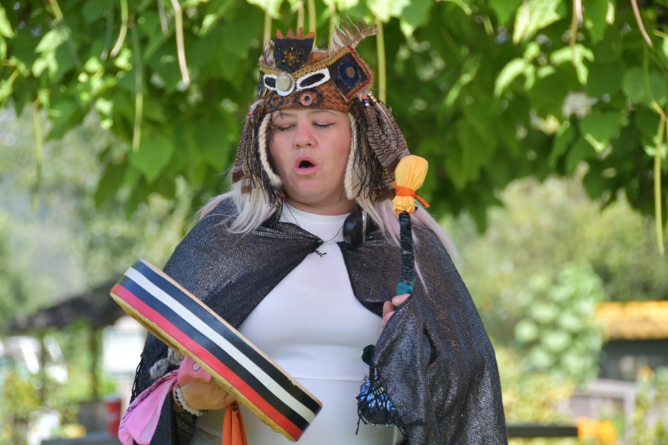 KFN member Kristinia Joe offers her welcome song at the grant announcement to raise the dike around IR1 in Coquitlam, on Aug. 15, 2024.