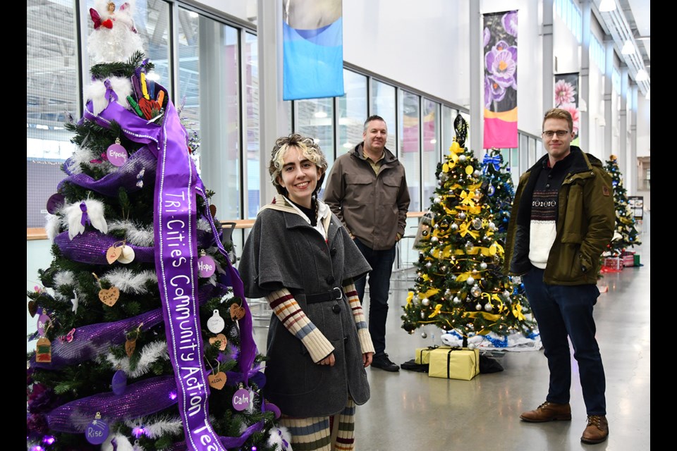 Paige McKenzie and Alex Code (right) of PoCo Heritage with Jesse Bannister of the Downtown PoCo BIA, at the Port Coquitlam Community Centre on Dec. 4, 2024.