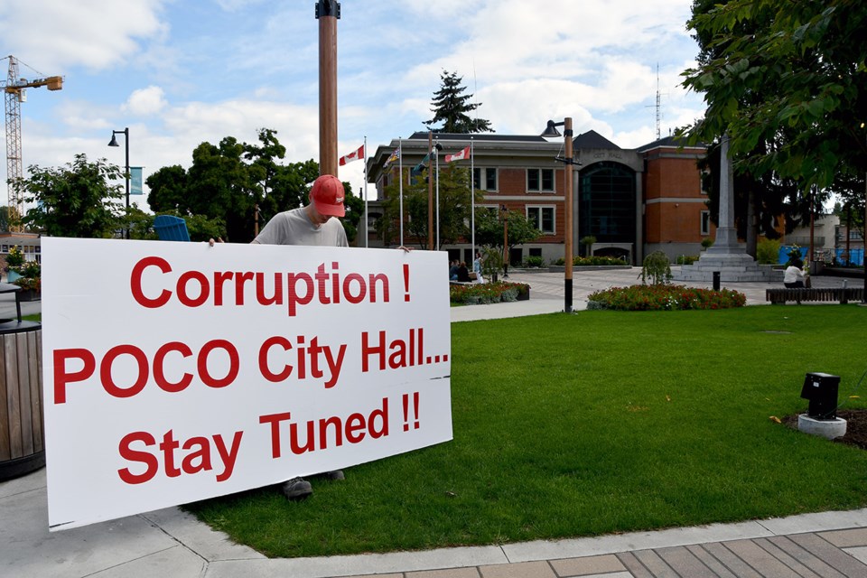 A young man who describes himself as an employee of Ground X told the "Tri-City News" he's being paid by his company to hold a protest sign in front of Port Coquitlam City Hall until the end of day Friday, Sept. 20, 2024.