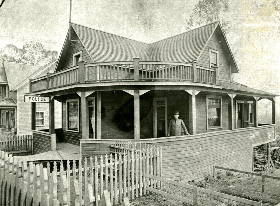 police-station-at-1318-brunette-with-pare-on-porch-1919