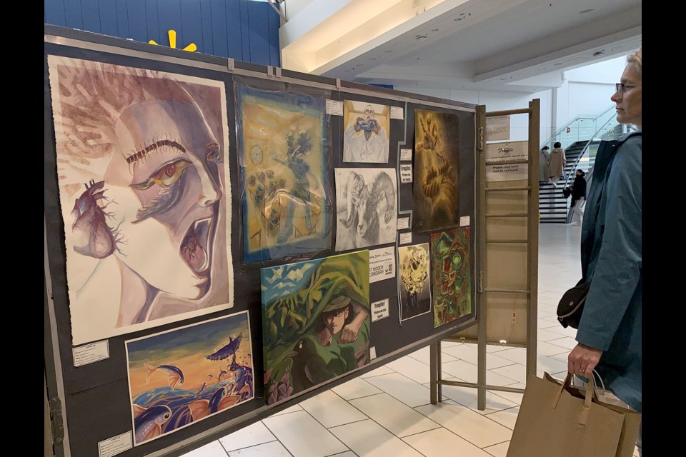 Shoppers at Coquitlam Centre mall can take a break and view the art exhibited by SD43 high school students.