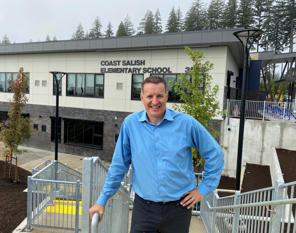 principal-frank-pearse-in-front-of-coast-salish-elementary-school