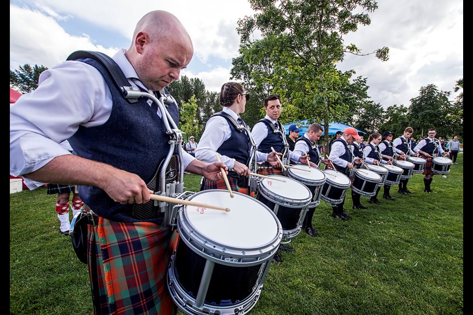 ScotFest 2024 at Town Centre Park: BC Pipers' Association Pipe Band Championship - SFU Pipe and Drum Band's drum line practicing before entering competition.