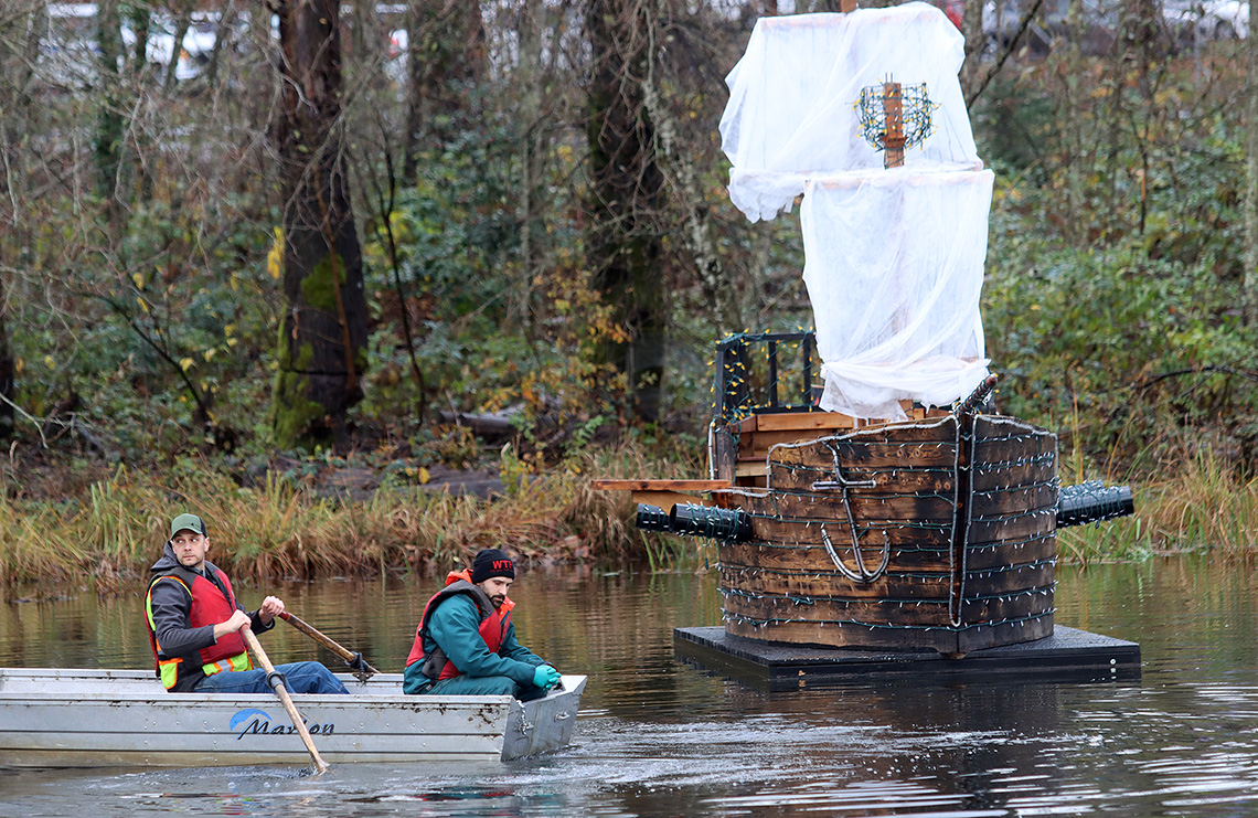 men in rowboat