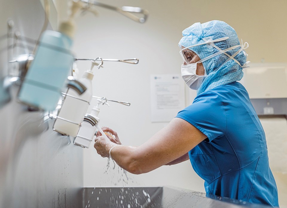 Woman washing hands hospital - Getty Images