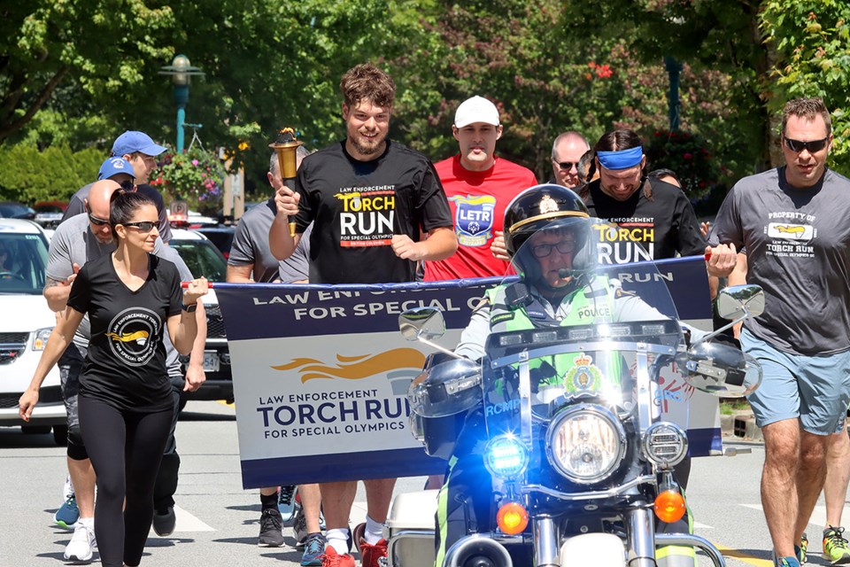 Participants in the Law Enforcement Torch Run for Special Olympics depart with a motorcycle escort from the Coquitlam RCMP detachment Wednesday morning.