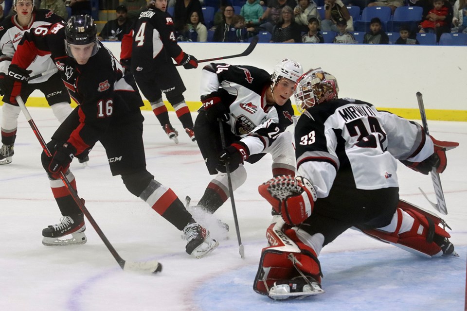 Vancouver Giants goalie Brett Mirwald stretches to make a save on Prince George Cougars forward Carter MacAdams in the second periof of their Western Hockey League pre-season game, Friday at the Port Coquitlam Community Centre.