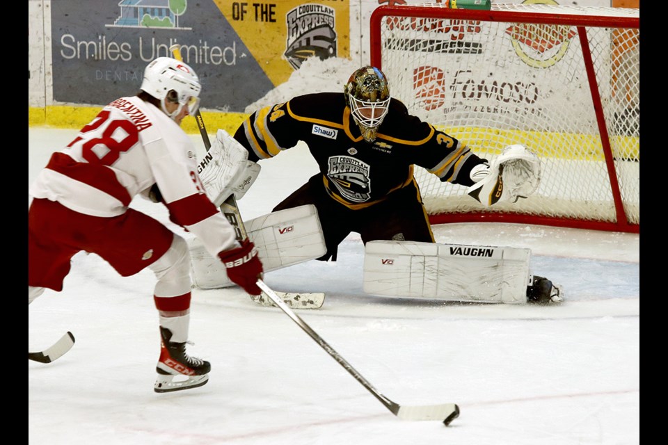 Coquitlam Express goalie Adam Manji gets in position to make a save on Chilliwack Chiefs forward Matt Argentina in the first period of their BC Hockey League game, Friday at the Poirier Sport and Leisure Complex.